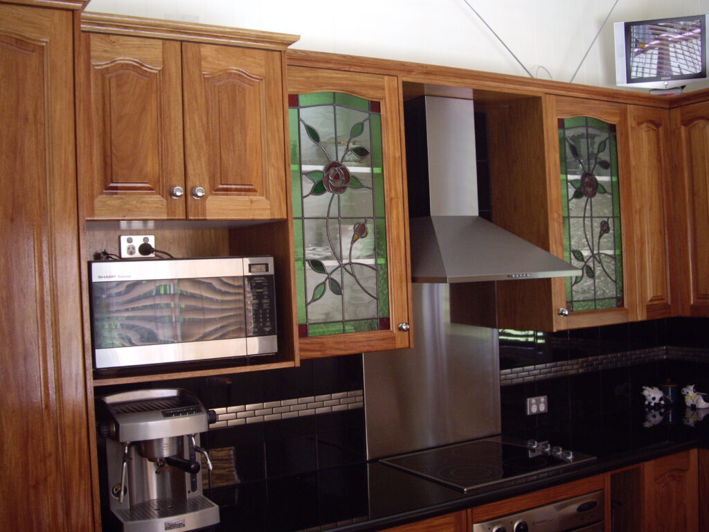 Wood door kitchen with Granite benchtop.